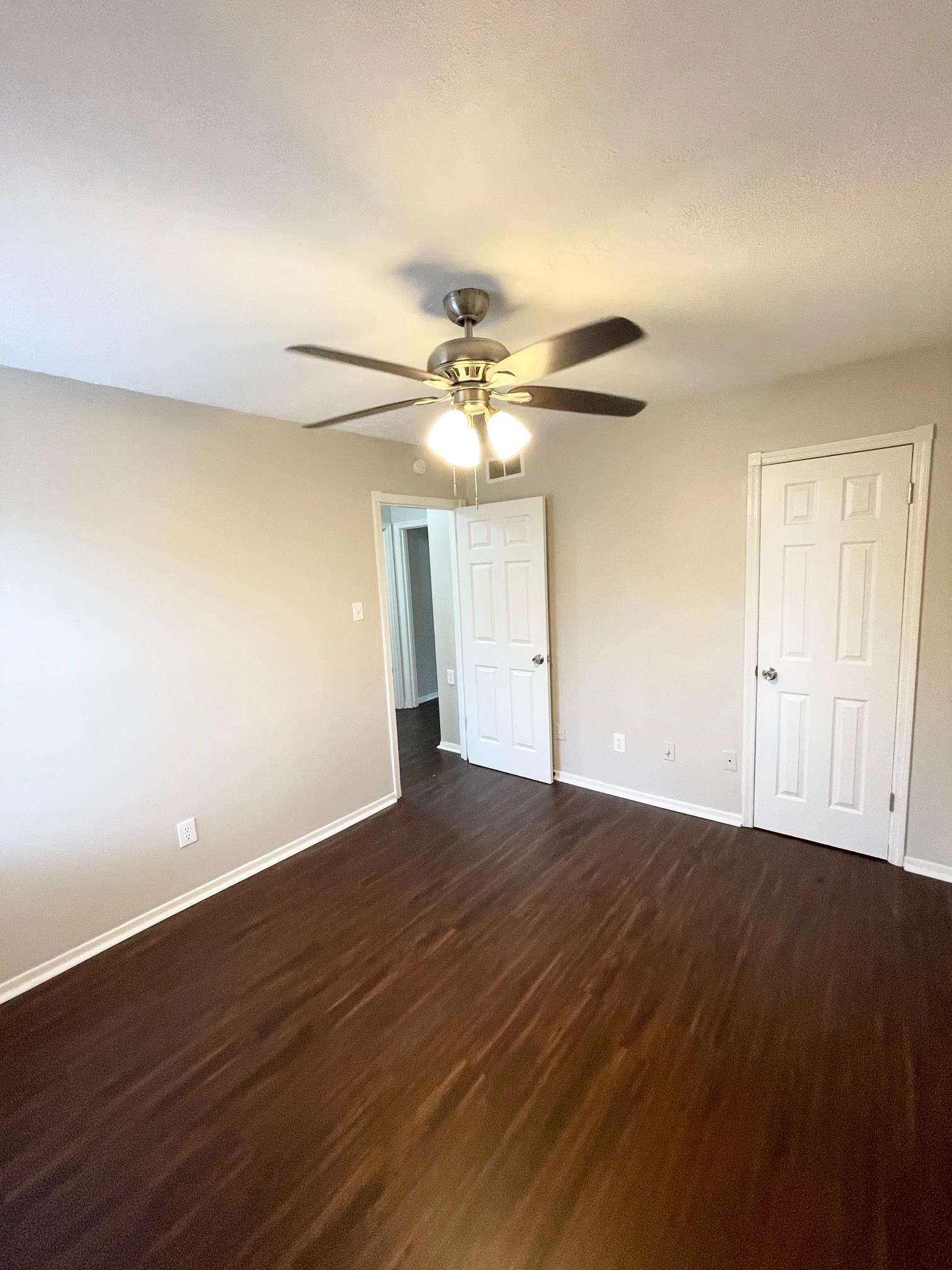 2952 Randy Lane Memphis, TN 38118 - Photo 7 of 11 a view of a room with wooden floor and a ceiling fan