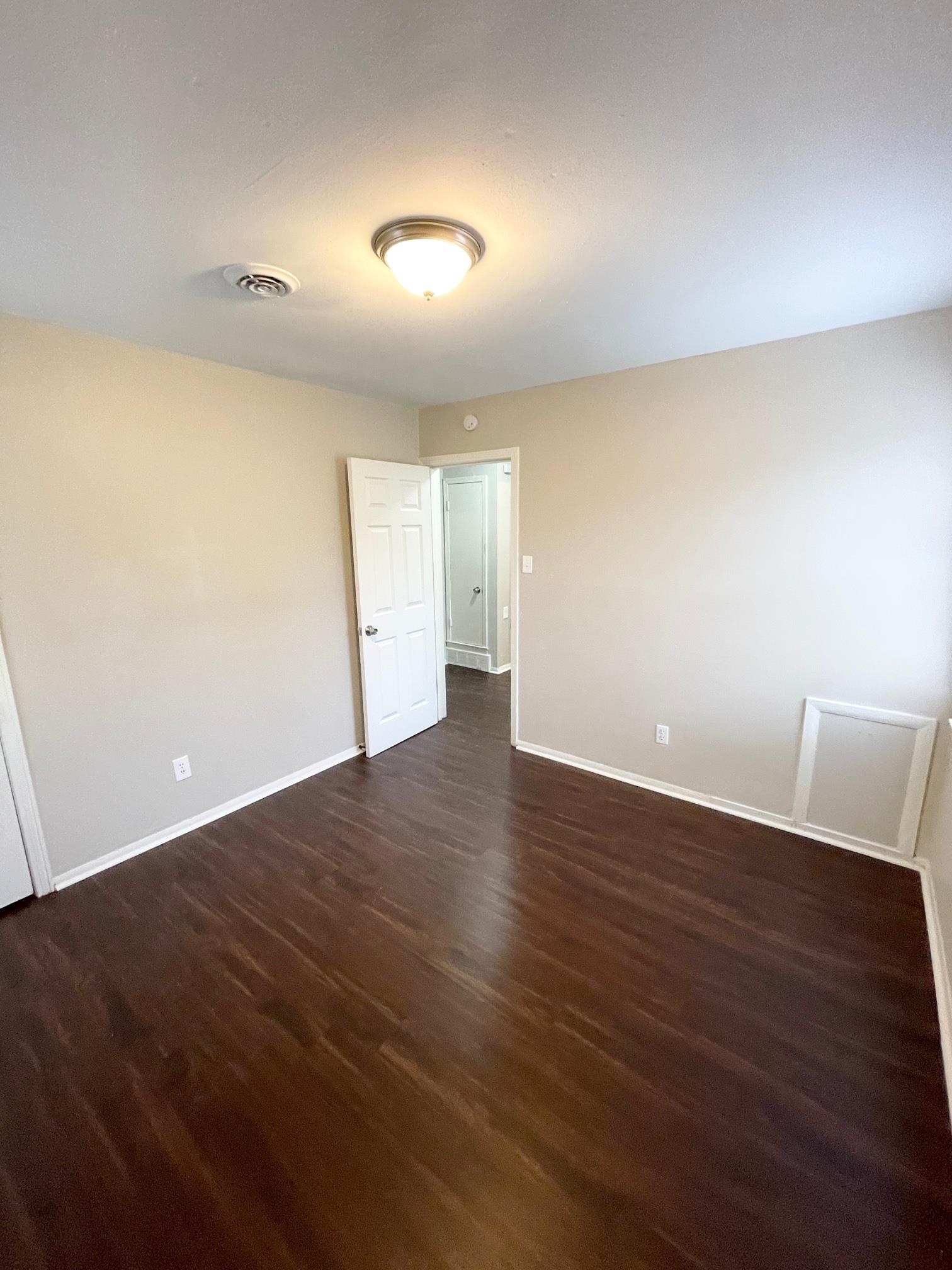 2952 Randy Lane Memphis, TN 38118 - Photo 9 of 11 a view of an empty room with wooden floor