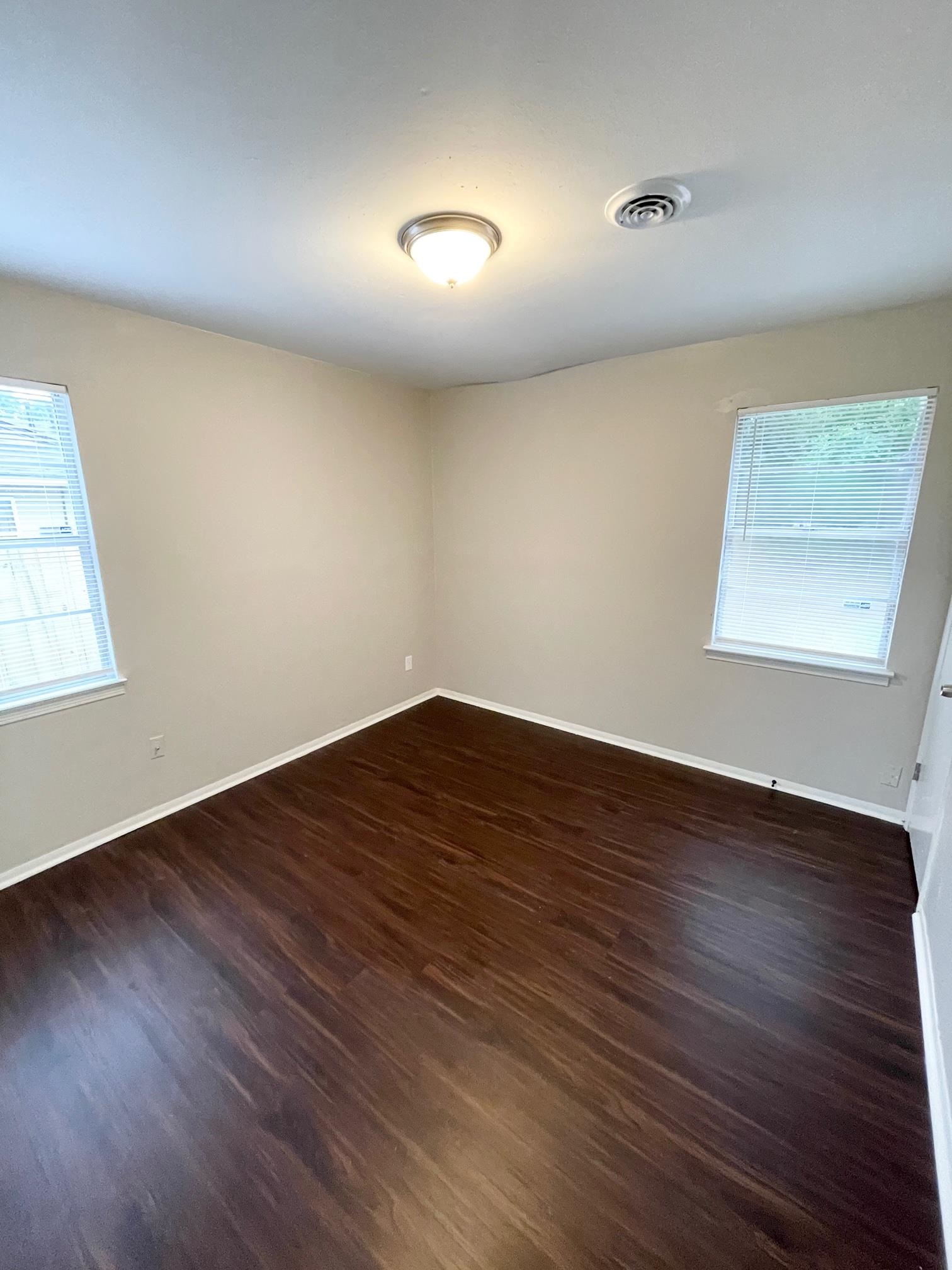2952 Randy Lane Memphis, TN 38118 - Photo 10 of 11 an empty room with wooden floor and windows