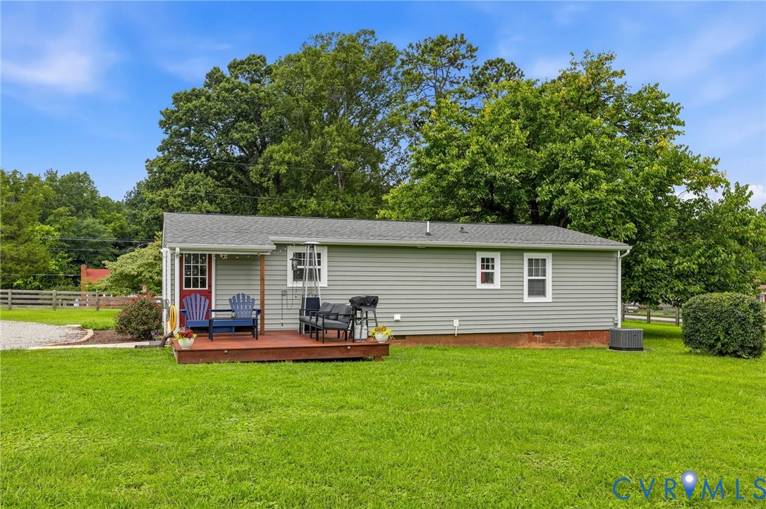 1108 Schroeder Road Powhatan, VA 23139 - Photo 11 of 33 Grey horizontal siding, wood deck, red entry door,