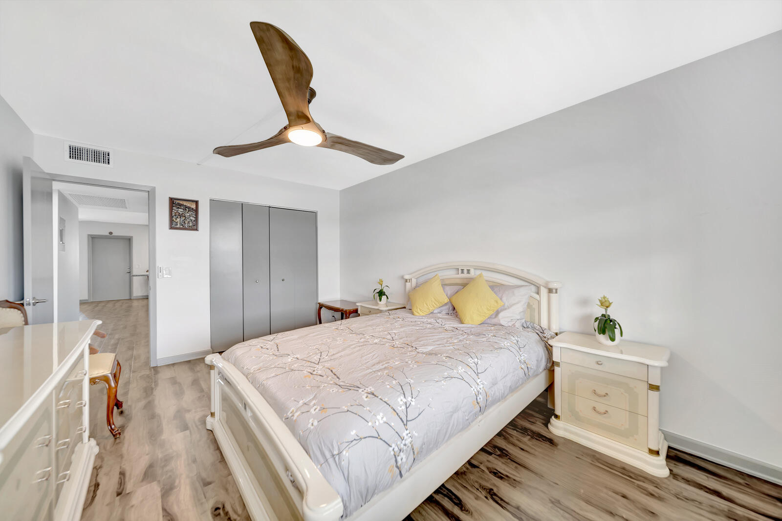 4063 Exeter Boca Raton, FL 33434 - Photo 22 of 55 a bedroom with a bed and a chandelier