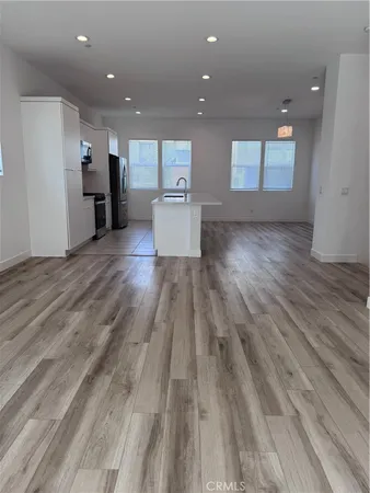 a view of kitchen with wooden floor
