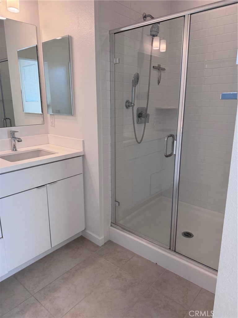 438 Hudson Street Brea, CA 92821 - Photo 20 of 29 a bathroom with a shower sink and mirror