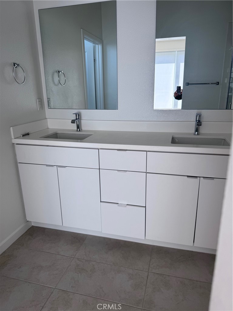 438 Hudson Street Brea, CA 92821 - Photo 23 of 29 a bathroom with a sink and a mirror