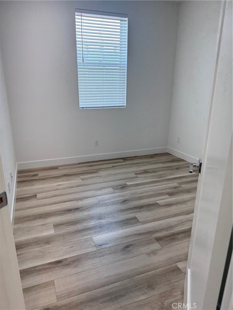 438 Hudson Street Brea, CA 92821 - Photo 26 of 29 a view of a room with wooden floor and a window