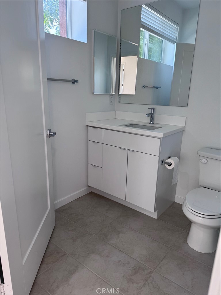 438 Hudson Street Brea, CA 92821 - Photo 5 of 29 a bathroom with a sink toilet and mirror