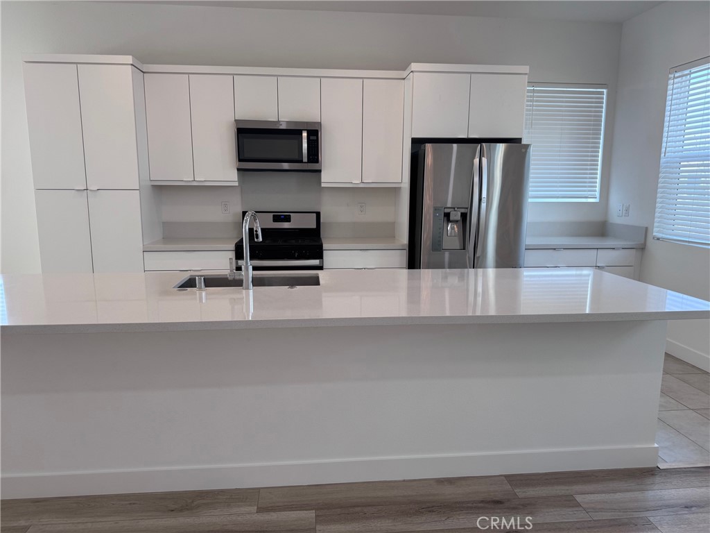 438 Hudson Street Brea, CA 92821 - Photo 8 of 29 a kitchen with a refrigerator and a stove
