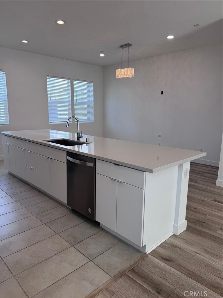438 Hudson Street Brea, CA 92821 - Photo 10 of 29 a kitchen with a sink and cabinets