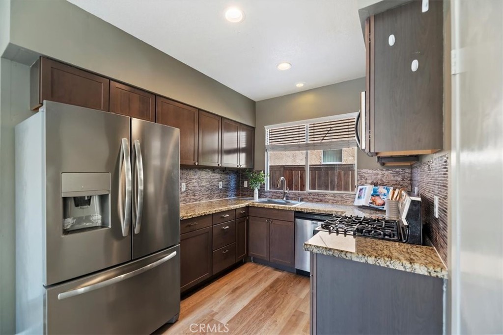 39557 Warbler Drive Temecula, CA 92591 - Photo 11 of 30 Upgraded cabinets & fixtures, granite counters, newer s/s appliances included!