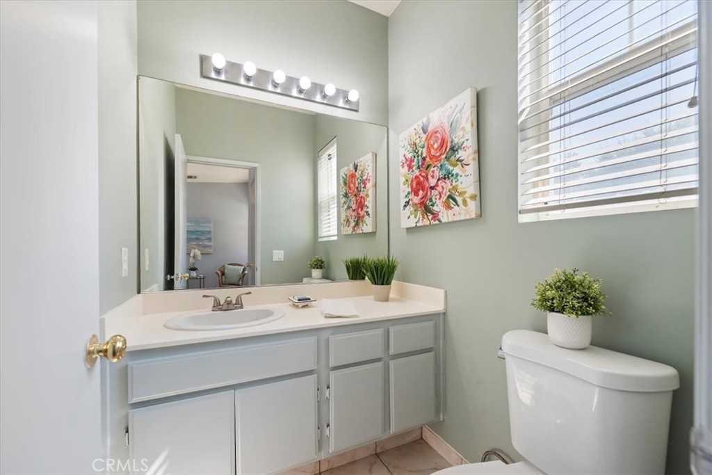 39557 Warbler Drive Temecula, CA 92591 - Photo 12 of 30 Powder room downstairs~fresh colors & upgraded fixtures!