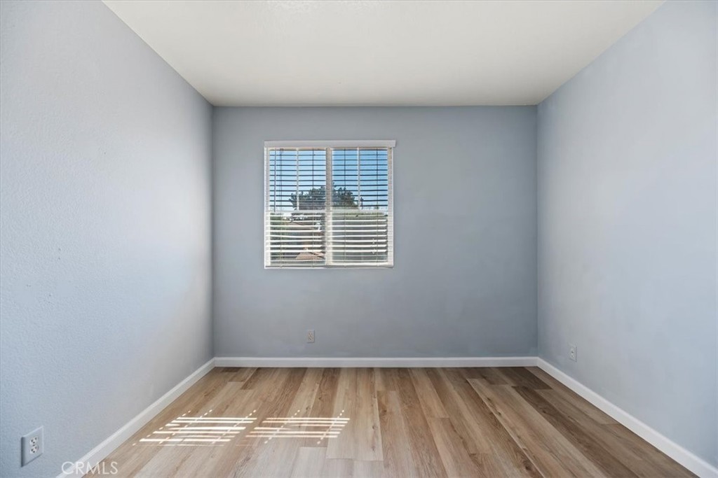 39557 Warbler Drive Temecula, CA 92591 - Photo 14 of 30 Bedroom ONE~ New baseboards & laminate flooring. Window blinds & Closet too!