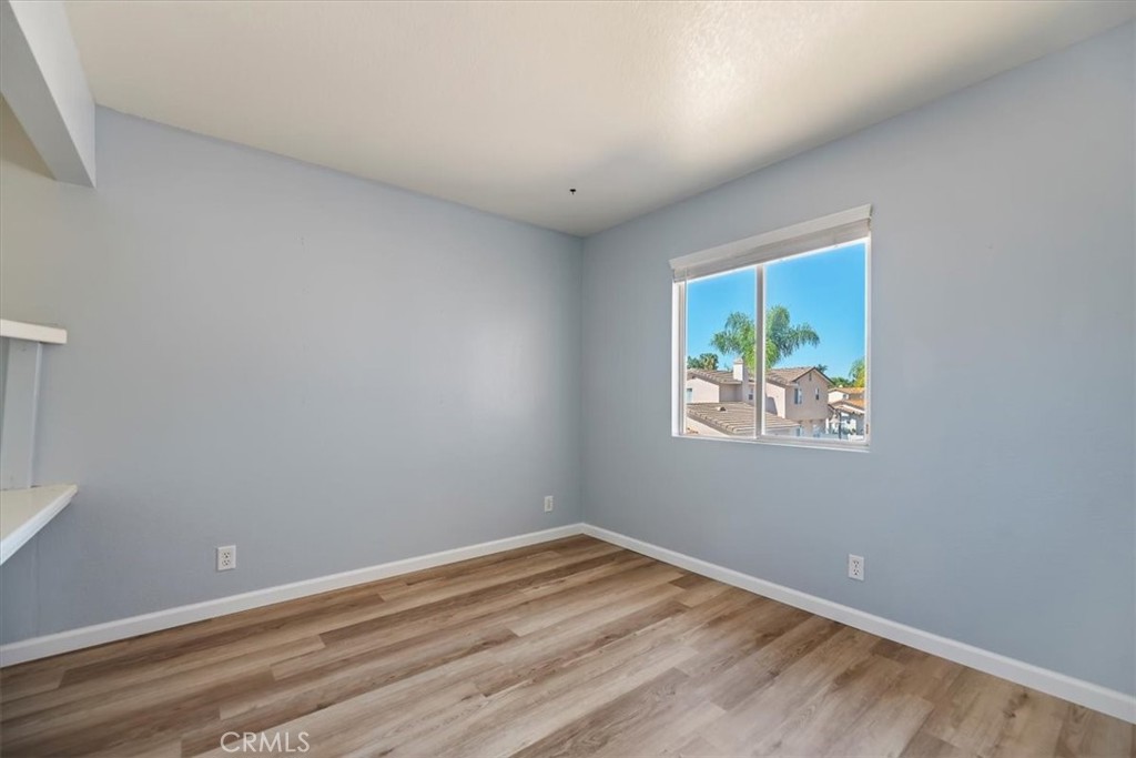 39557 Warbler Drive Temecula, CA 92591 - Photo 16 of 30 Bedroom TWO~ New baseboards, laminate floors & fresh paint! Blinds & closet area~