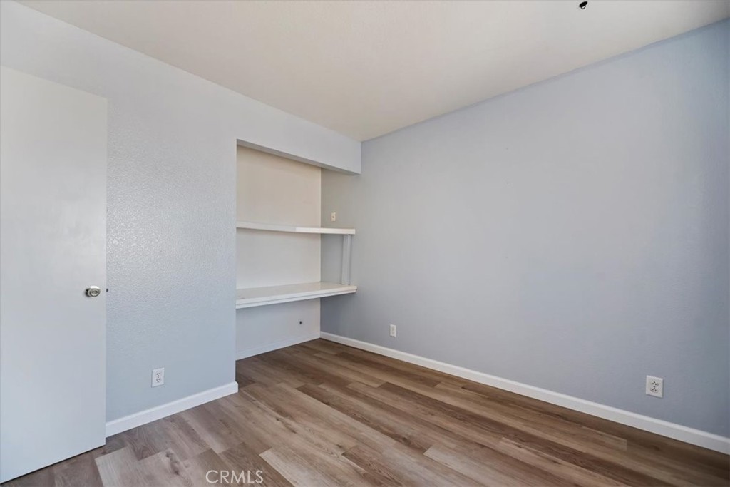 39557 Warbler Drive Temecula, CA 92591 - Photo 17 of 30 Bedroom TWO~ Fresh paint, new baseboards & flooring! Closet area w/shelving.