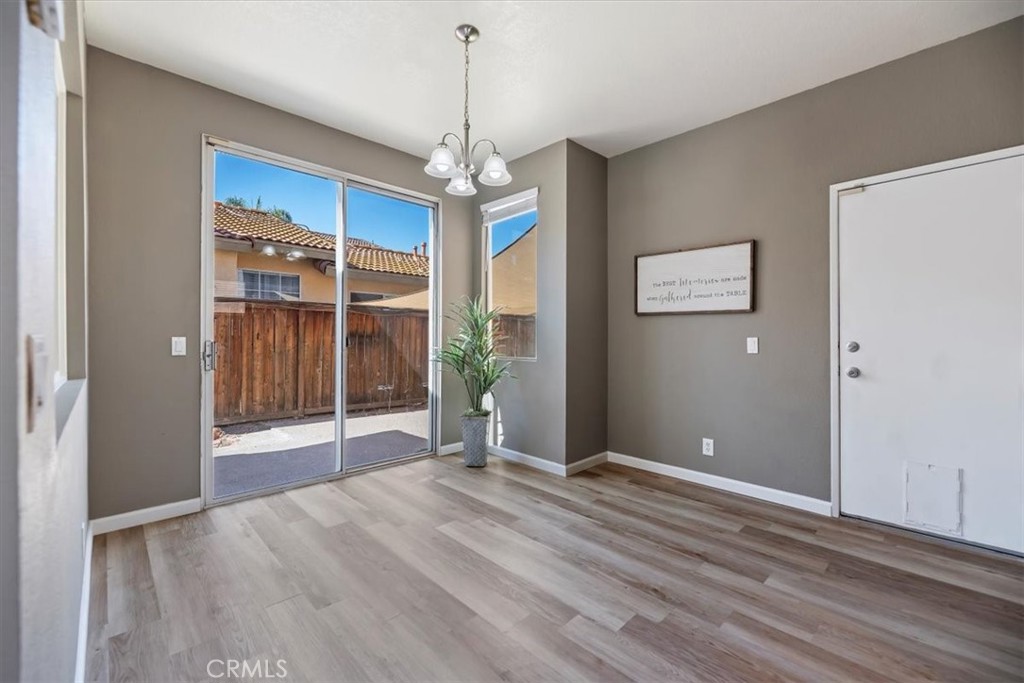 39557 Warbler Drive Temecula, CA 92591 - Photo 10 of 30 Dining room w/soft colors, new baseboards & laminate flooring!