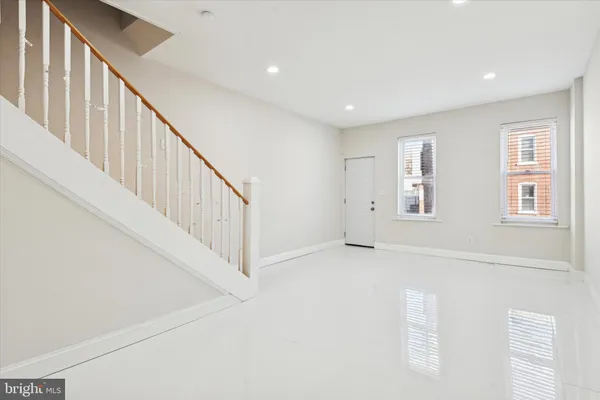 a view of an empty room with stairs