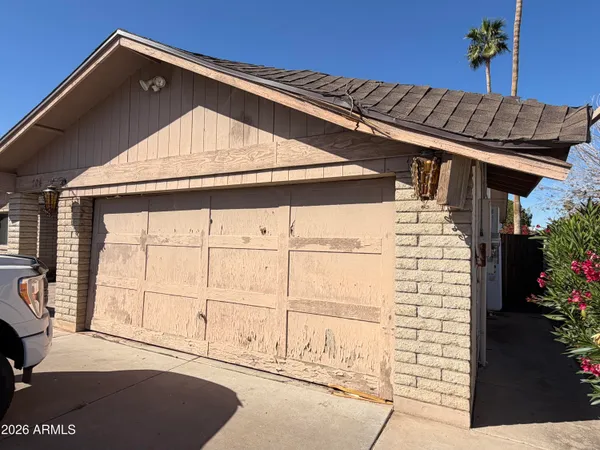 a front view of a house with a garage