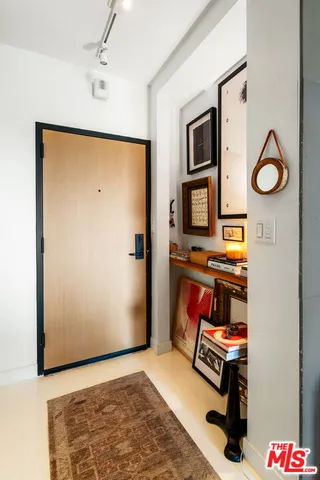 a view of an entryway with wooden floor