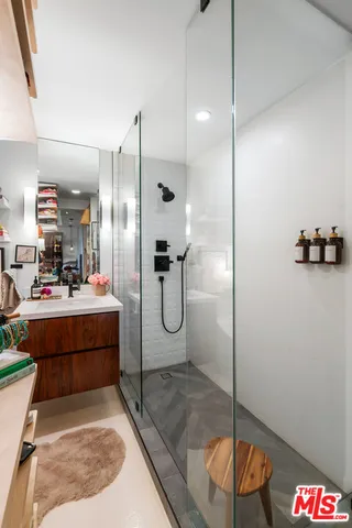 a bathroom with a tub and shower