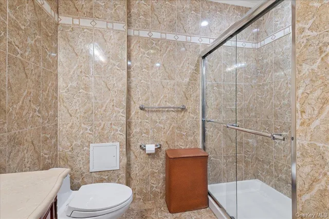 a toilet sitting next to a bathroom sink