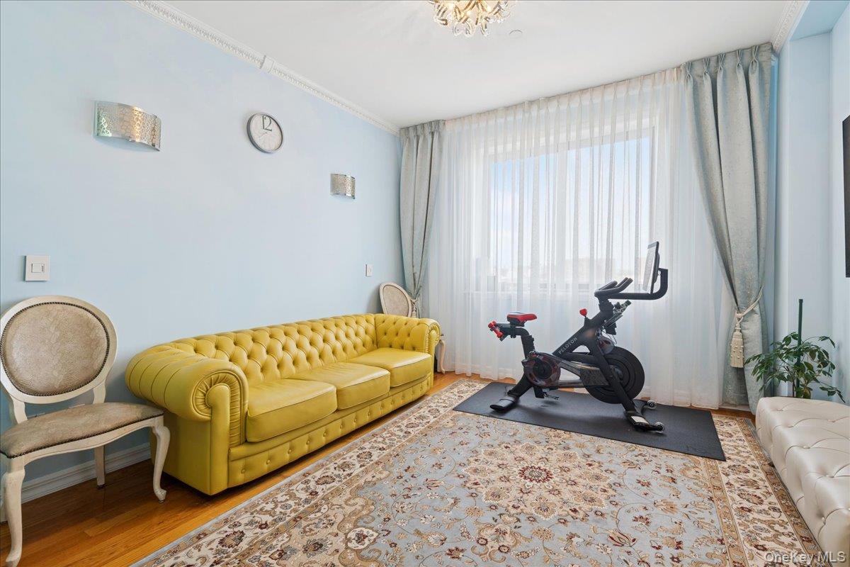 99-31 66th Avenue, Unit 7B Queens, NY 11374 - Photo 19 of 26 a bedroom with bed and a window