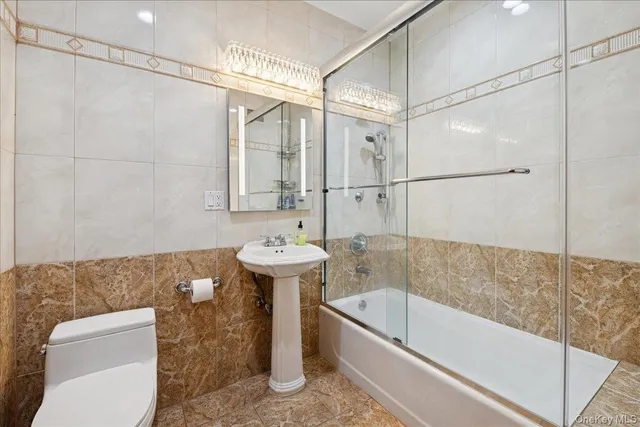 a bath room with a bath tub and a shower