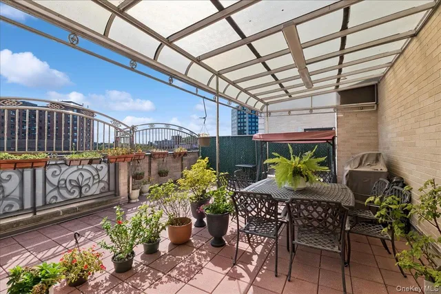 a view of a chairs and table in a patio