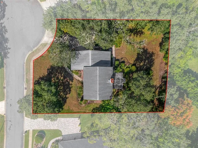 a view of a chandelier in big room with wooden floor