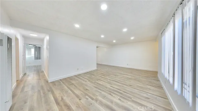 a view of hallway with wooden floor