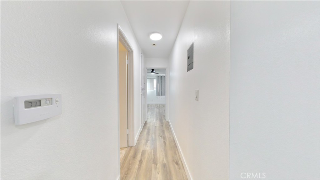 1648 Vía Mirada, Unit B Fullerton, CA 92833 - Photo 20 of 30 a view of a hallway with wooden floor