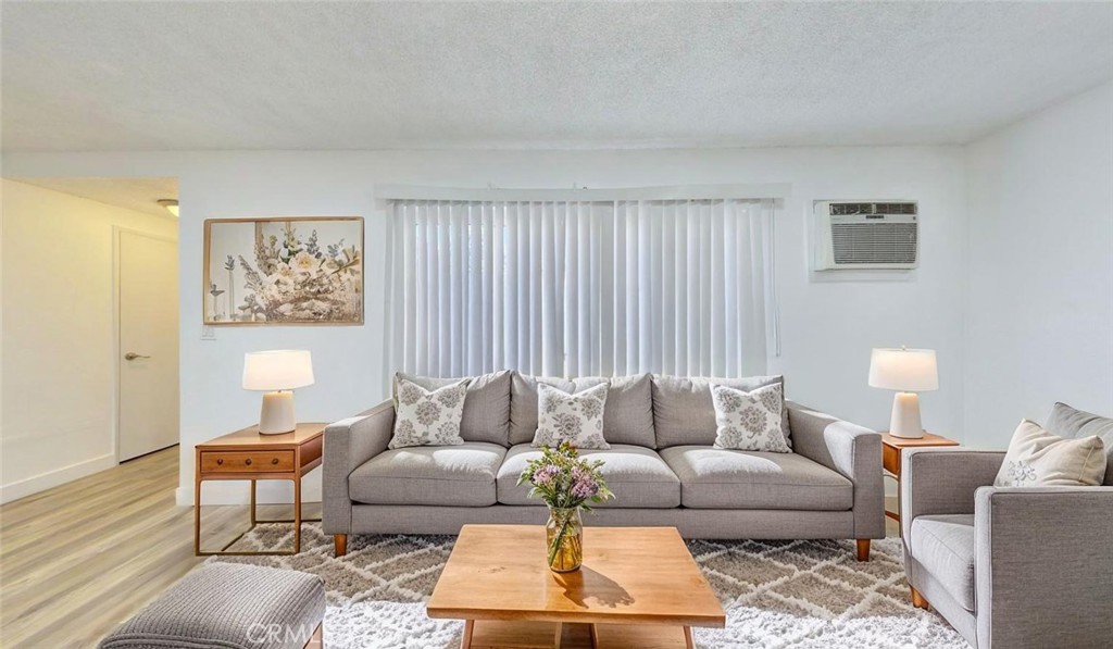 1648 Vía Mirada, Unit B Fullerton, CA 92833 - Photo 9 of 30 a living room with furniture and a large window