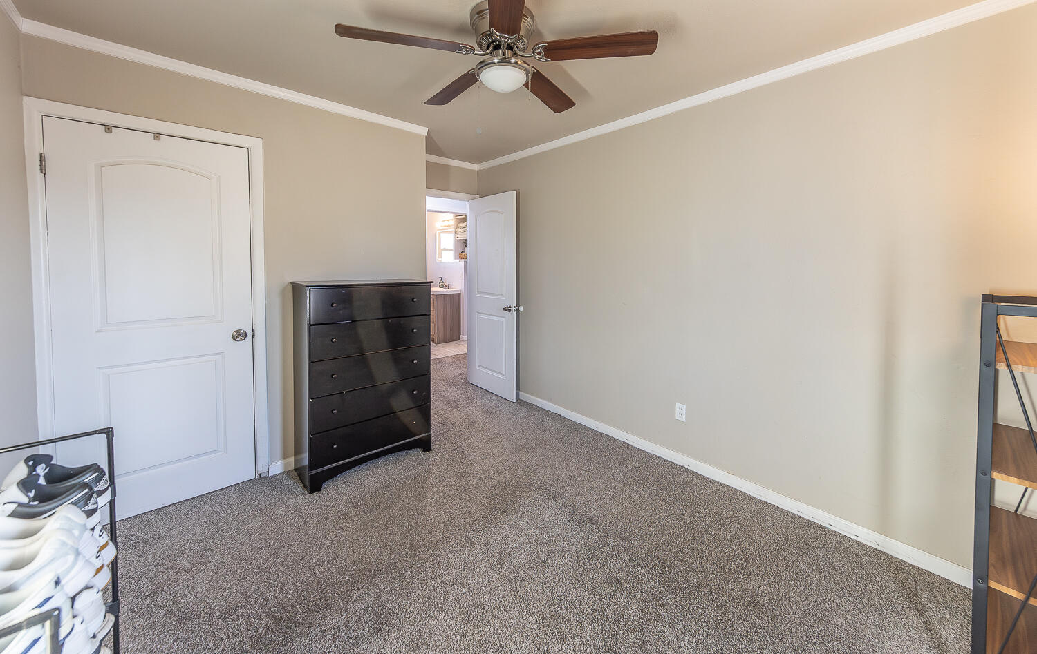 5109 44th Street Lubbock, TX 79414 - Photo 15 of 20 a view of a livingroom with a ceiling fan and window