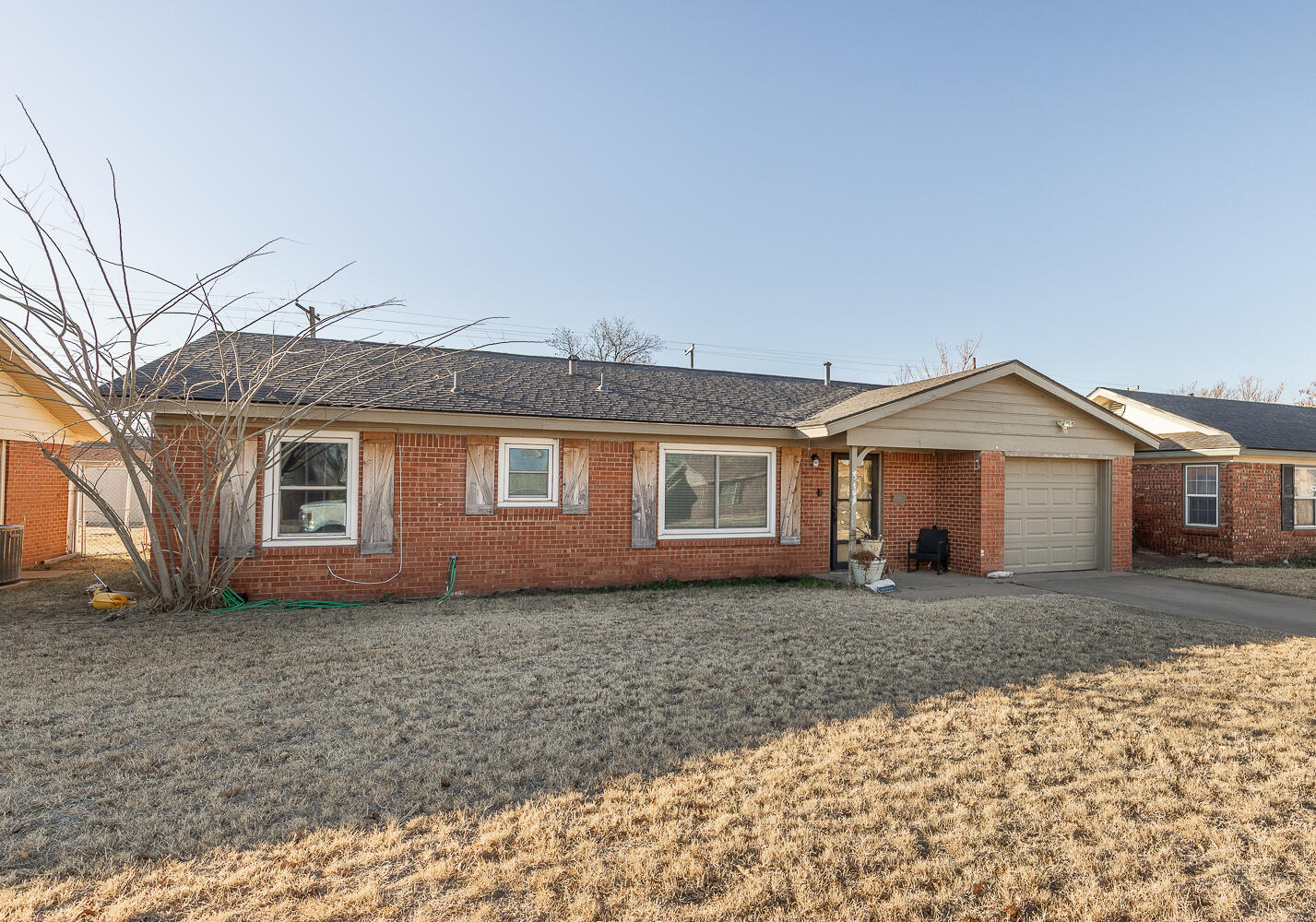 5109 44th Street Lubbock, TX 79414 - Photo 17 of 20 a front view of a house with a yard