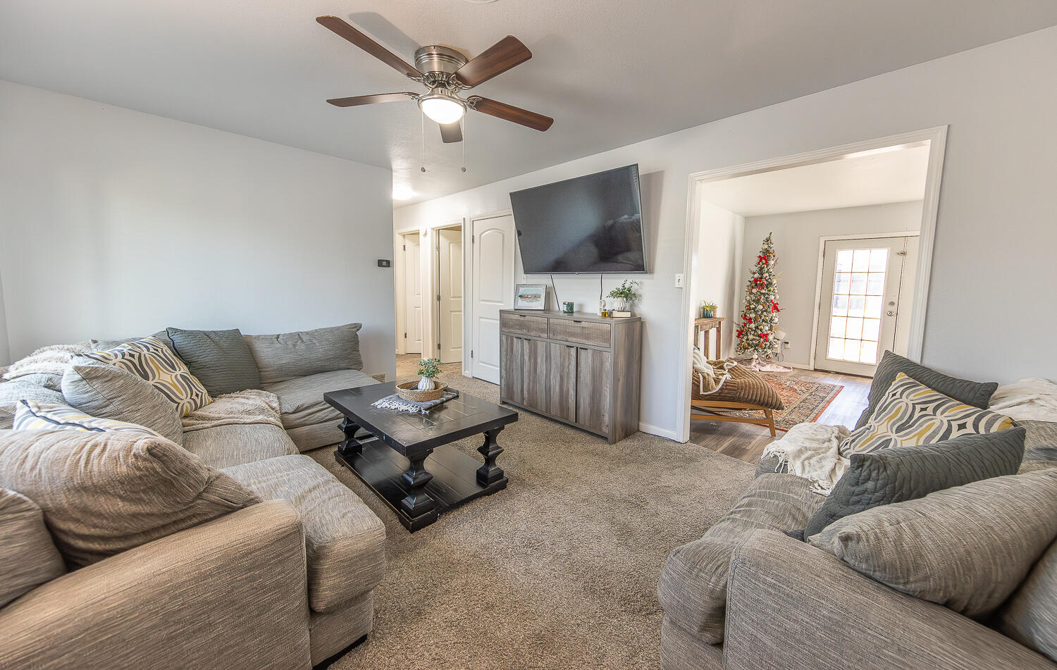 5109 44th Street Lubbock, TX 79414 - Photo 2 of 20 a living room with furniture and a flat screen tv