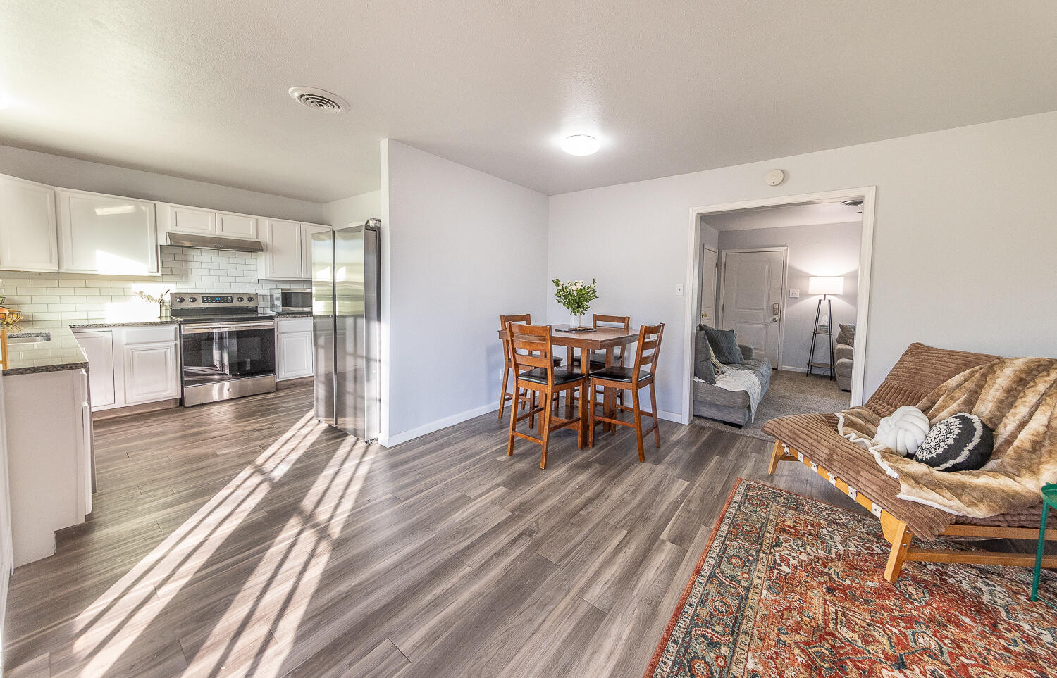 5109 44th Street Lubbock, TX 79414 - Photo 5 of 20 a living room with furniture and kitchen view