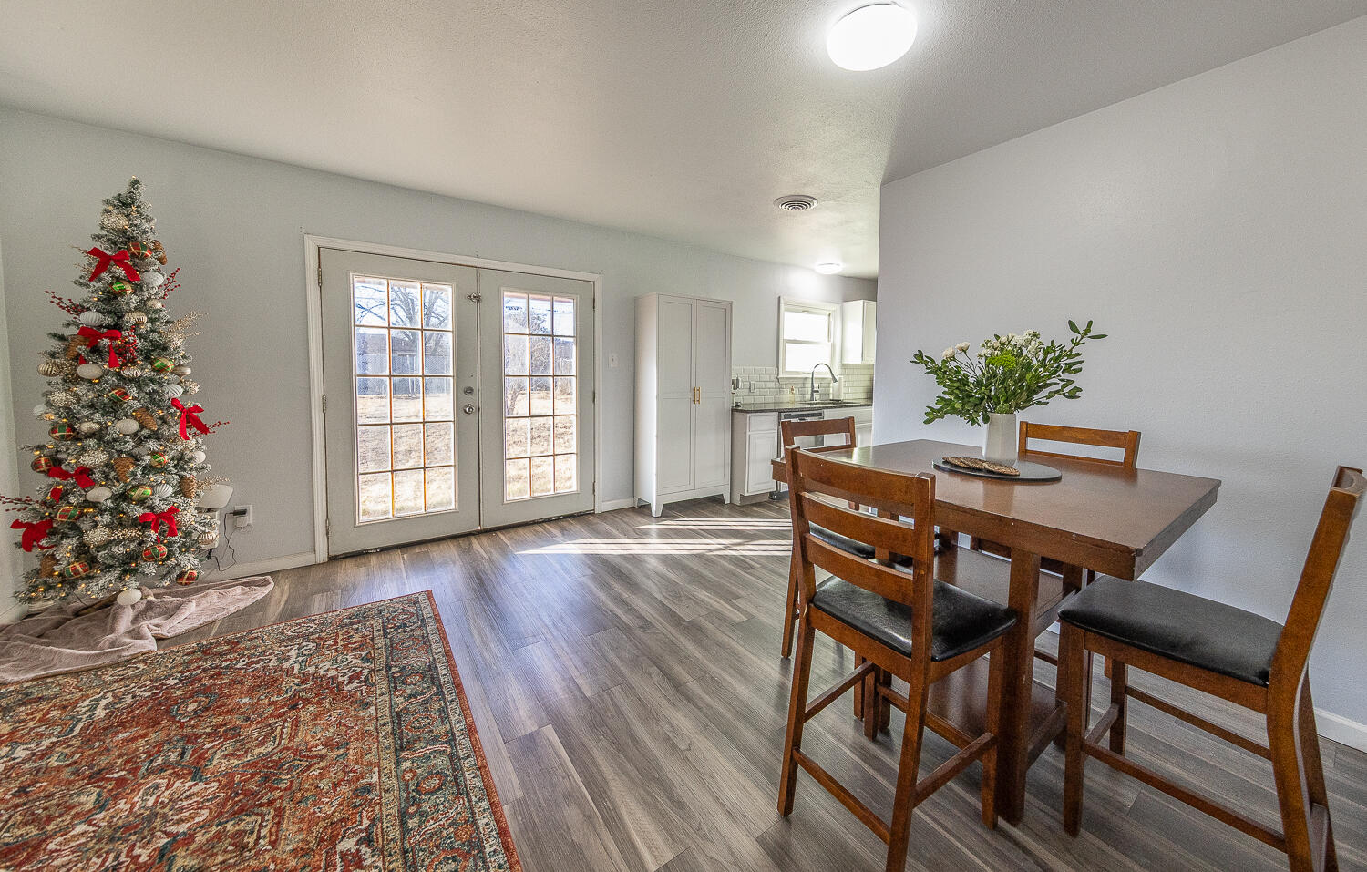 5109 44th Street Lubbock, TX 79414 - Photo 6 of 20 a view of a dining room with furniture window and wooden floor