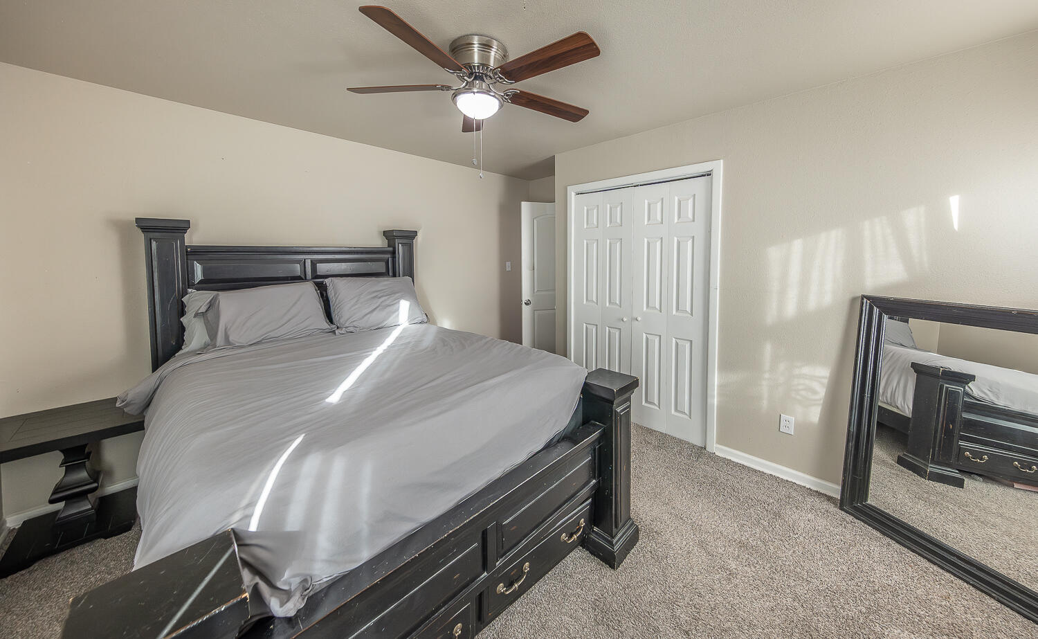 5109 44th Street Lubbock, TX 79414 - Photo 10 of 20 a bedroom with a bed and a ceiling fan