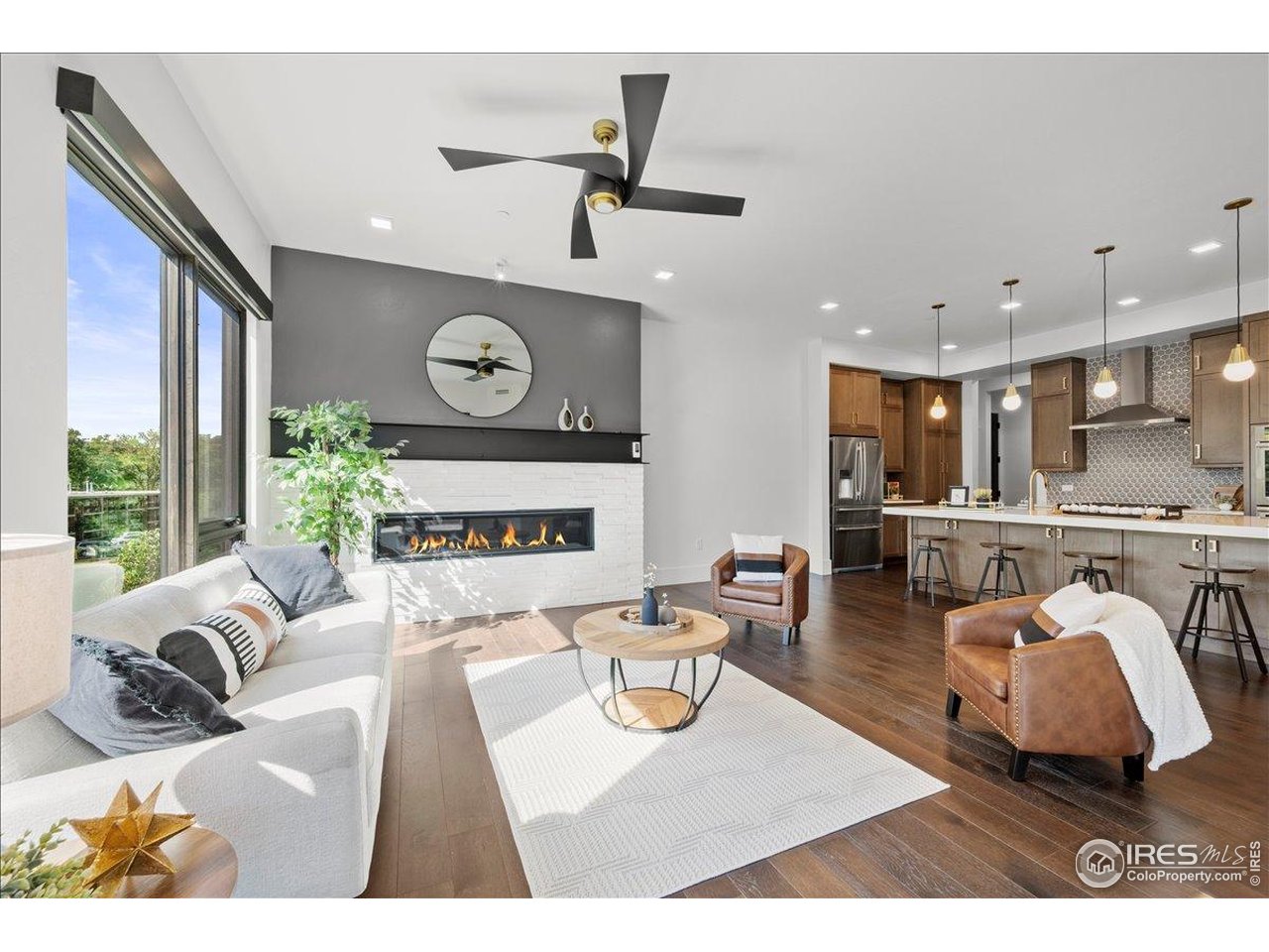 a living room with furniture and a clock