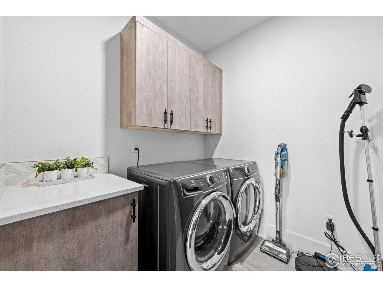 302 North Meldrum Street, Unit 313 Fort Collins, CO 80521 - Photo 13 of 38 a utility room with dryer and washer