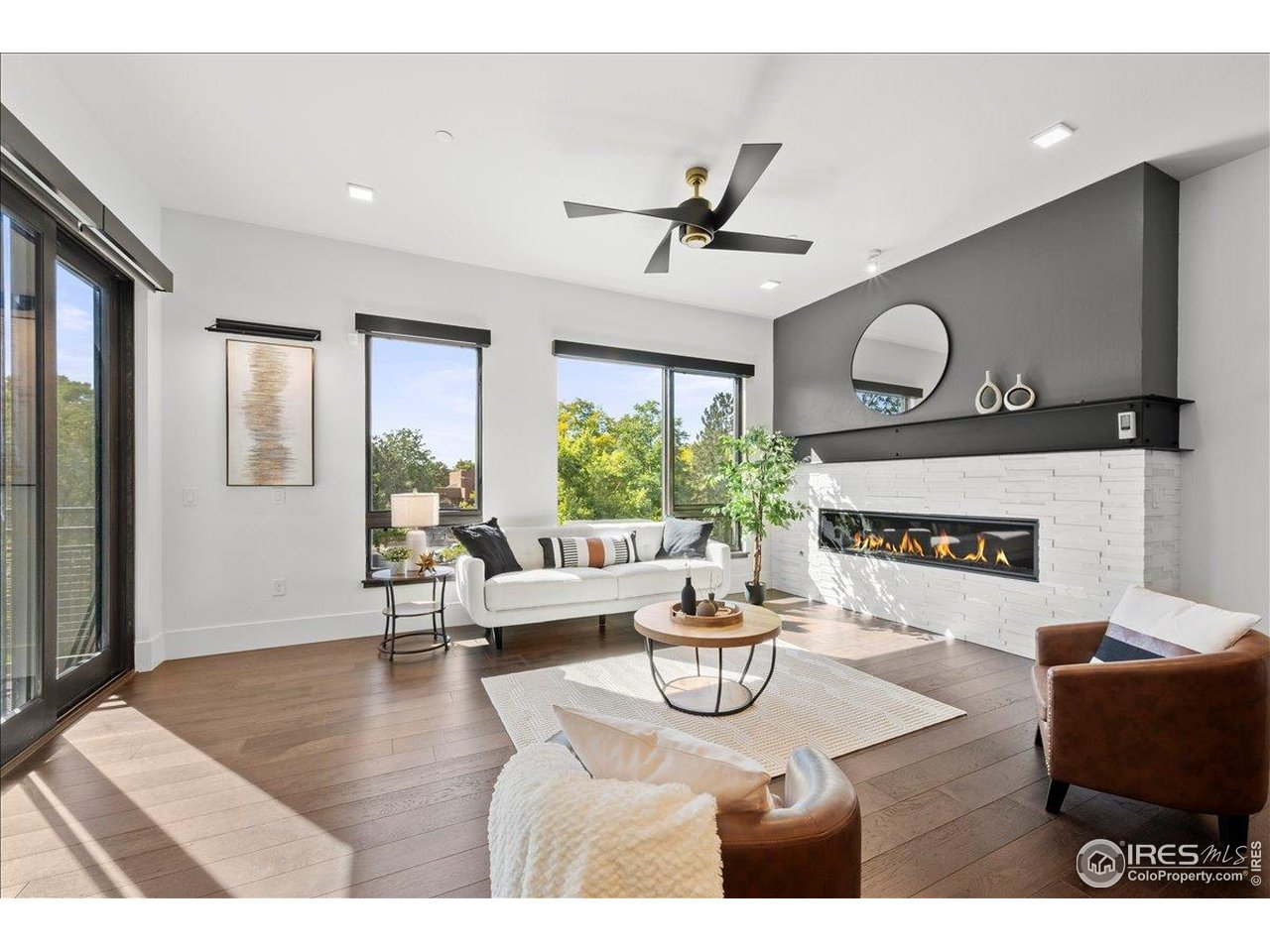 302 North Meldrum Street, Unit 313 Fort Collins, CO 80521 - Photo 37 of 38 a living room with furniture and a large window