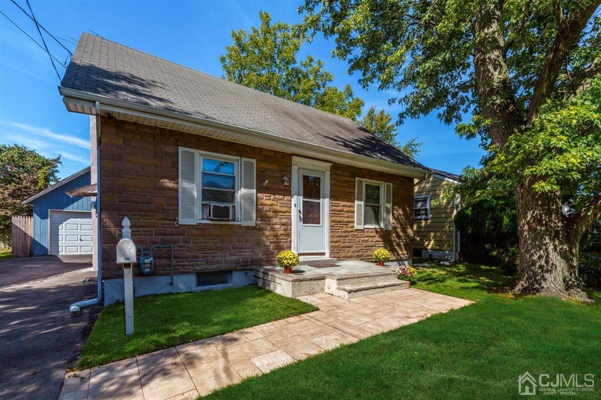284 Old Post Road Edison, NJ 08817 - Photo 2 of 27 a front view of a house with a yard and table and chairs