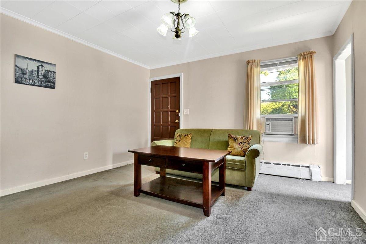284 Old Post Road Edison, NJ 08817 - Photo 11 of 27 a living room with furniture and a window