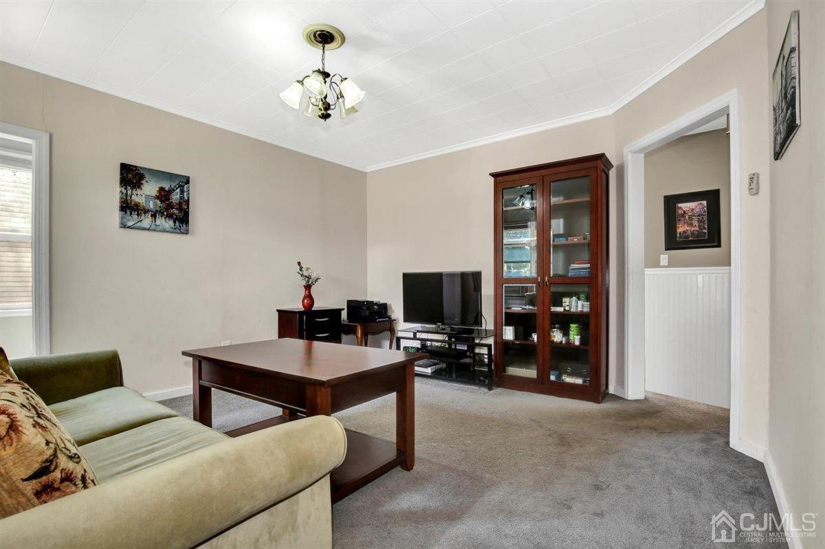 284 Old Post Road Edison, NJ 08817 - Photo 12 of 27 a living room with furniture and a flat screen tv