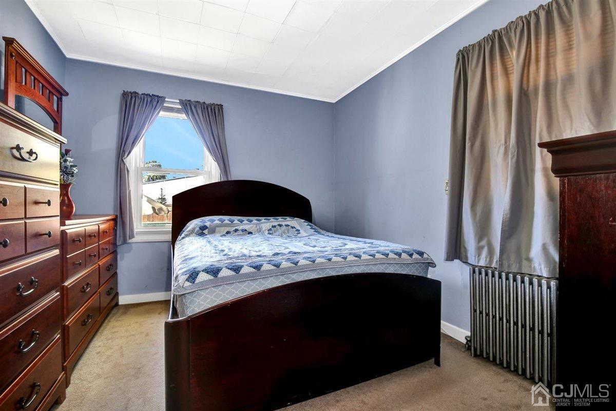 284 Old Post Road Edison, NJ 08817 - Photo 13 of 27 a bedroom with a bed and a window