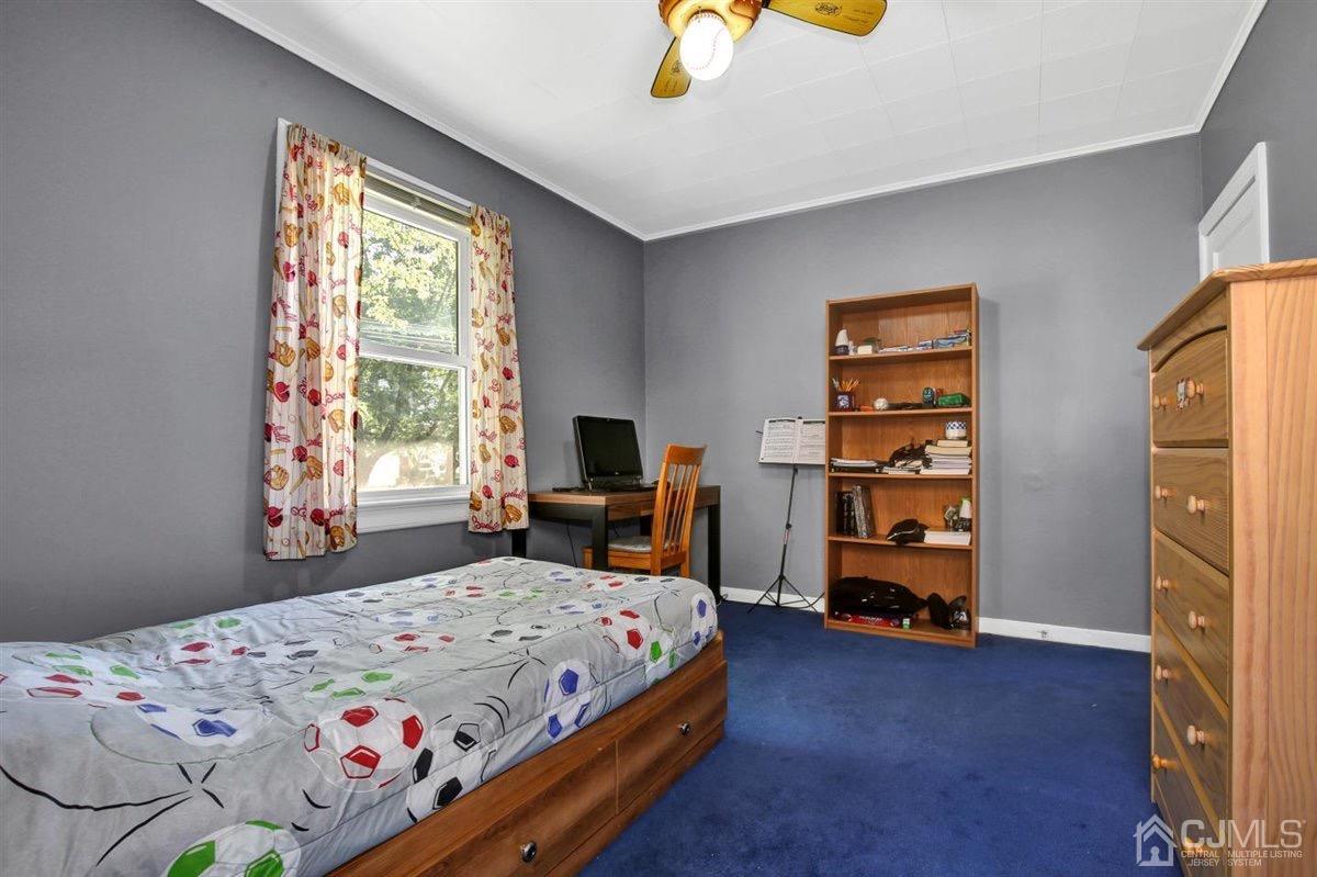 284 Old Post Road Edison, NJ 08817 - Photo 15 of 27 a bedroom with a bed and a window