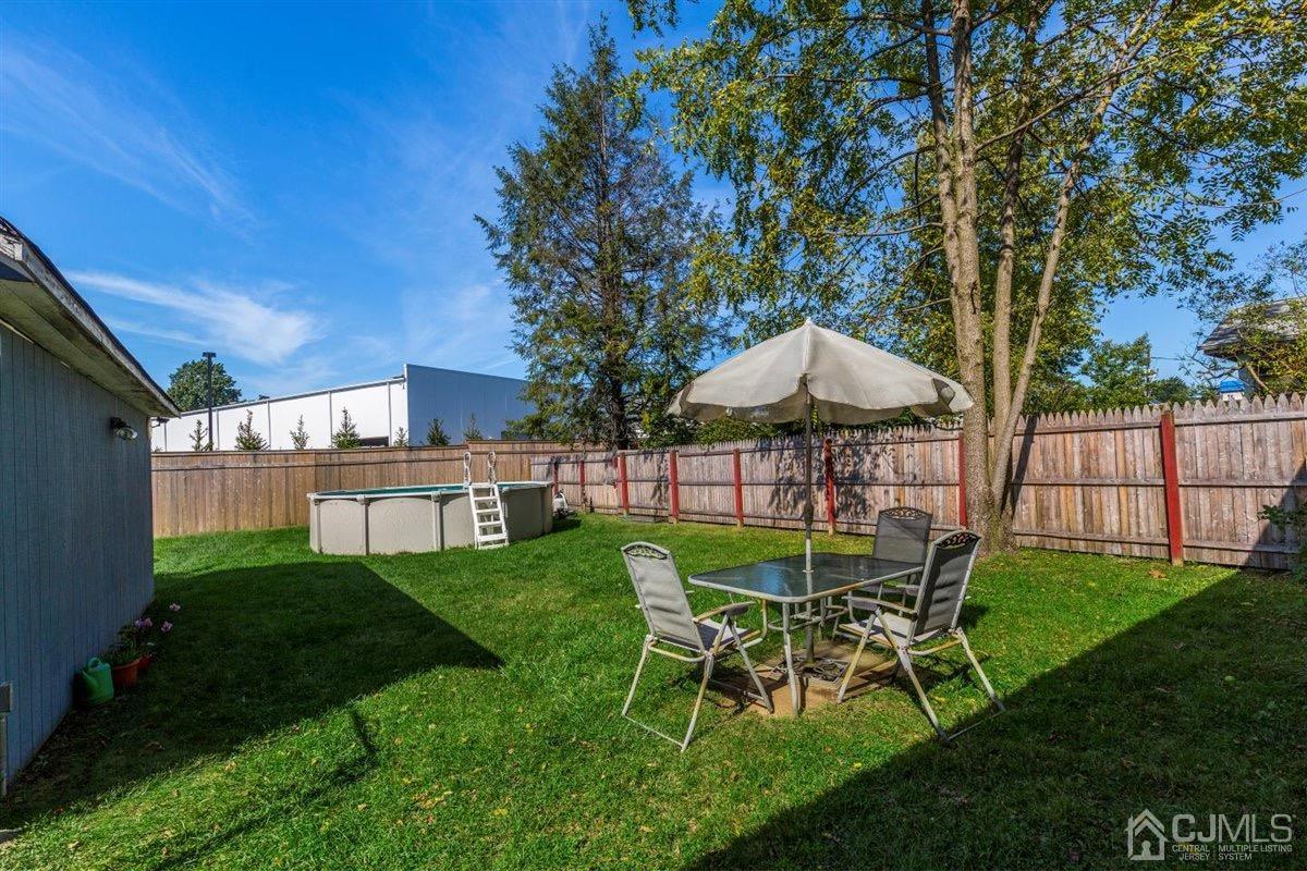 284 Old Post Road Edison, NJ 08817 - Photo 20 of 27 a view of a table and chairs in backyard