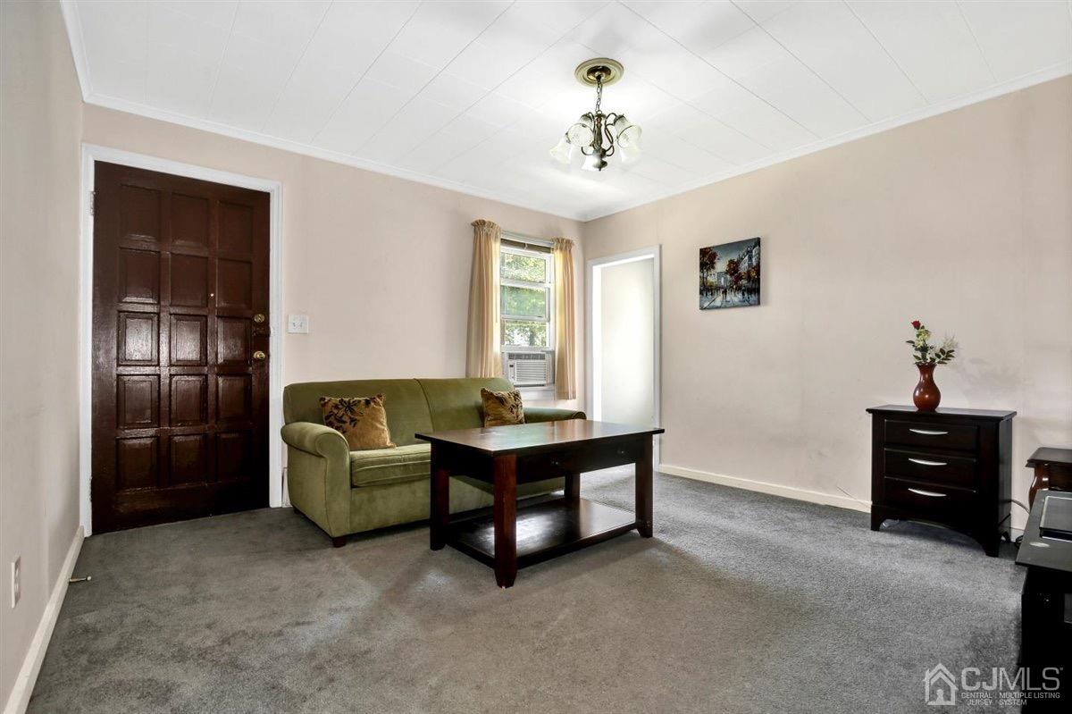284 Old Post Road Edison, NJ 08817 - Photo 10 of 27 a living room with furniture and a chandelier