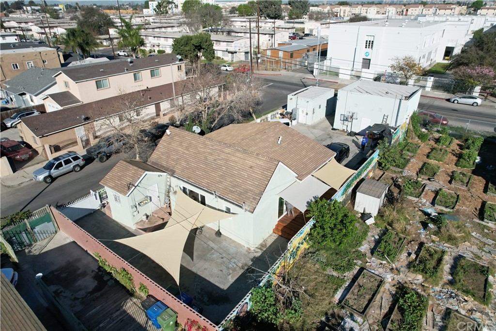 an aerial view of a house with garden space and sitting space