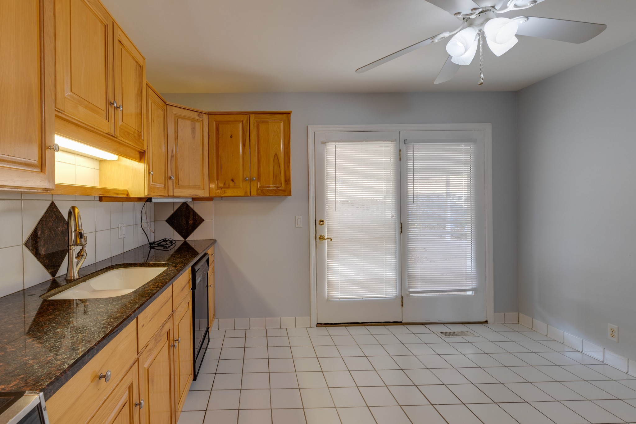 508 Ridgemont Drive Dickson, TN 37055 - Photo 12 of 44 a kitchen with a sink a stove cabinets and a window