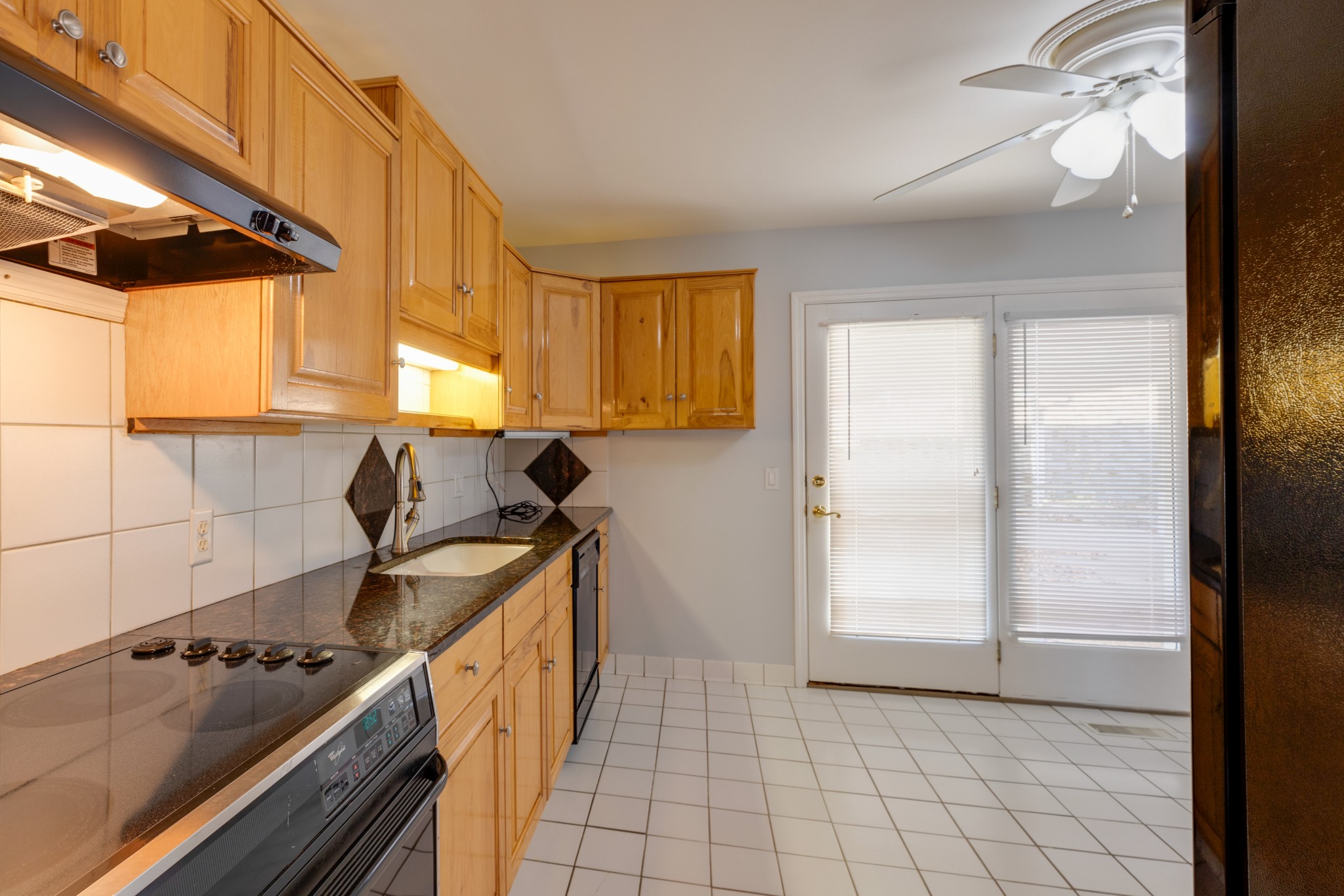 508 Ridgemont Drive Dickson, TN 37055 - Photo 13 of 44 a kitchen with a stove a sink and a refrigerator