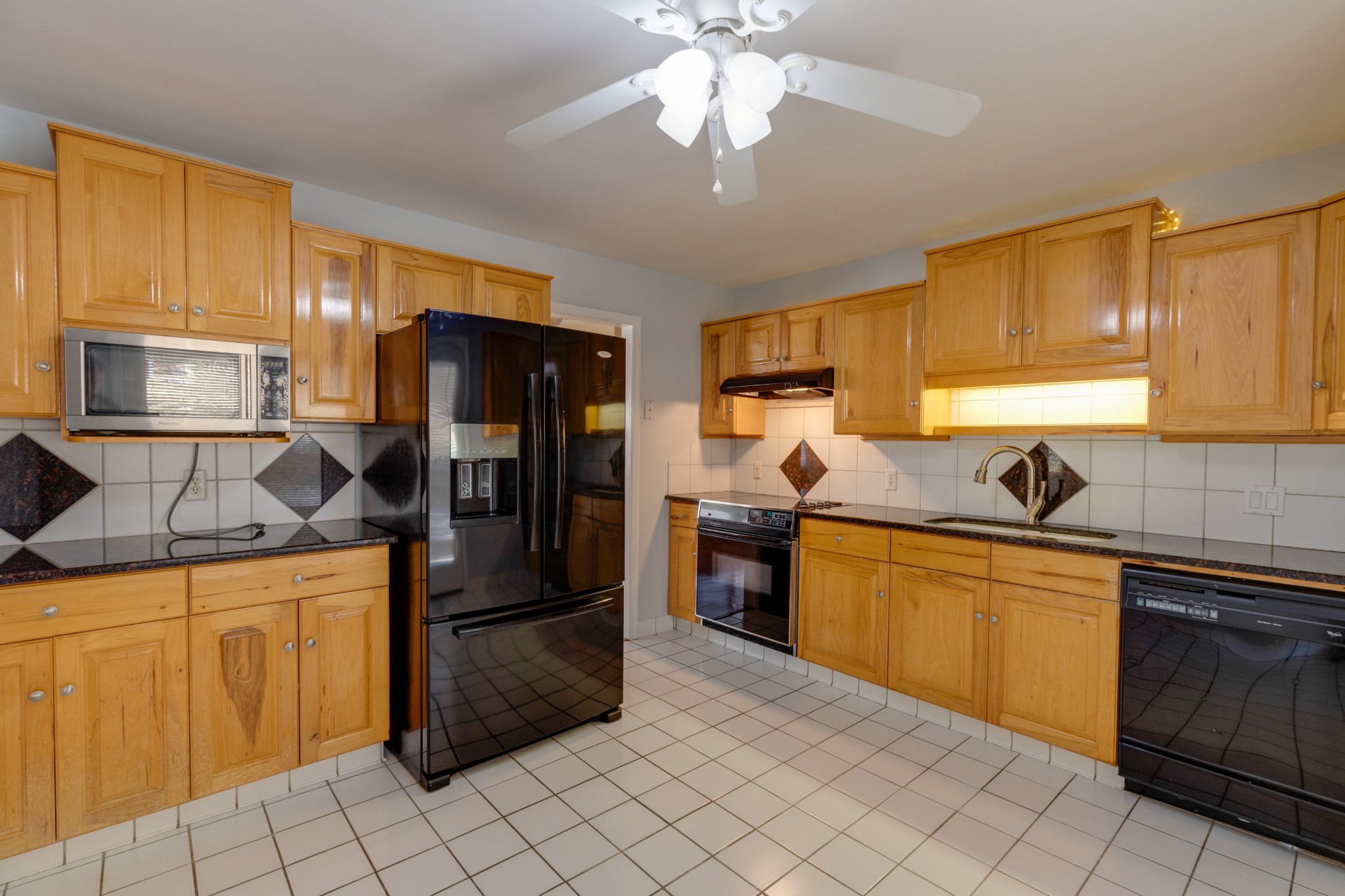 508 Ridgemont Drive Dickson, TN 37055 - Photo 14 of 44 a kitchen with stainless steel appliances granite countertop a sink and a refrigerator